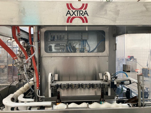 Used Axtra filling monoblock with labeller 7