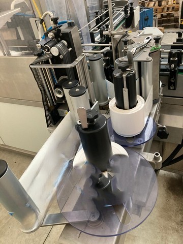 Used Axtra filling monoblock with labeller 8