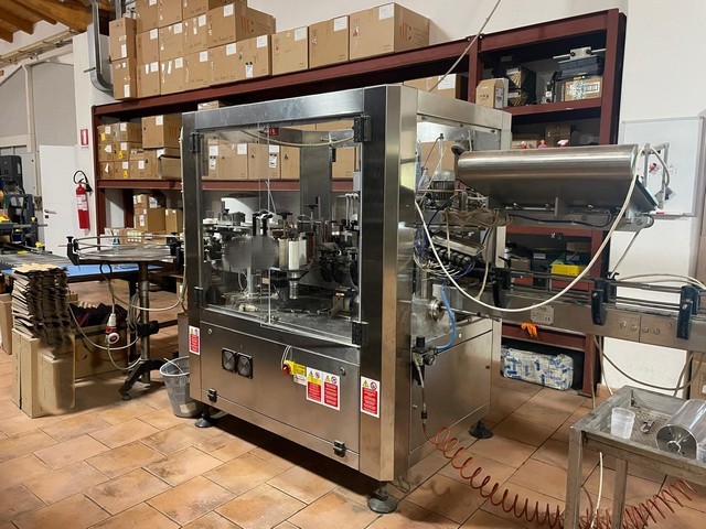 Used OMAR capsuling machine 2t polylaminate with 3s adhesive labeller 3