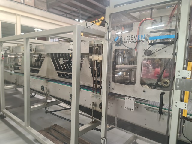 Used hot melt wrap Around Loeven 12